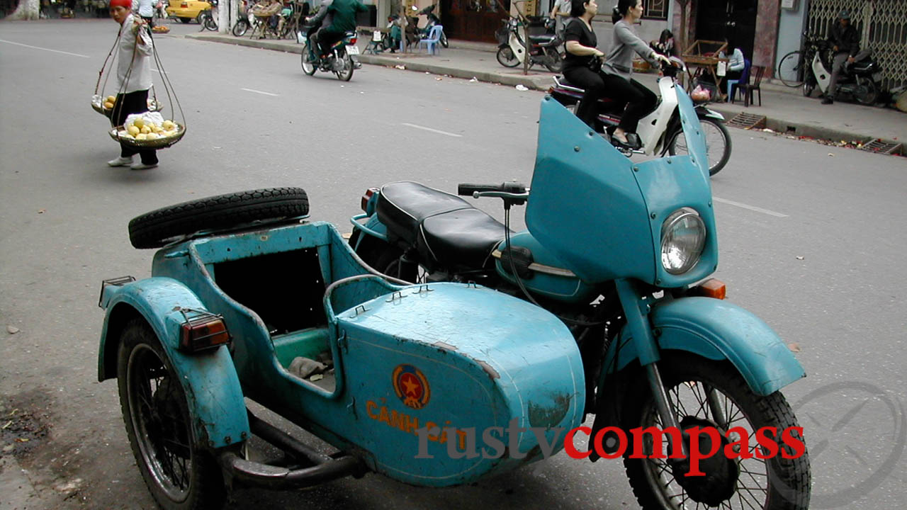 Hanoi police motorbike with sidecar in Nha Tho St. Late 1990s.